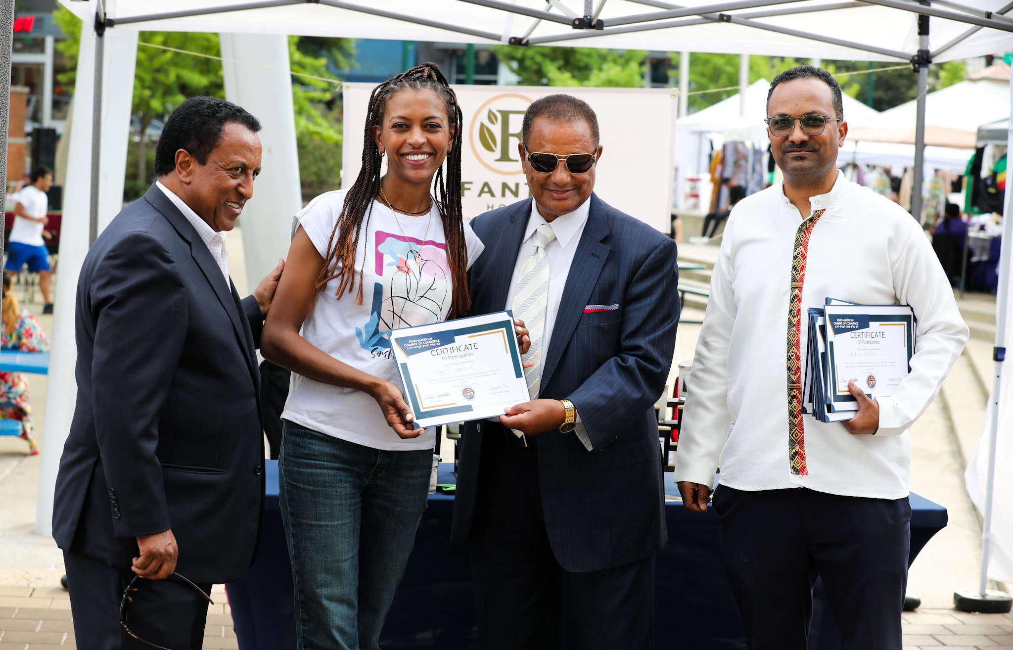 Business Industry Show 2024 participant receiving a certificate